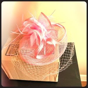 Pink fascinator hate with birdcage veil
